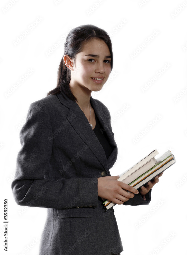 Female university student smiling and carrying some notebooks Female university student smiling and carrying some notebooks