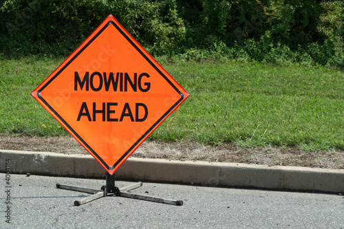 Mowing ahead sign