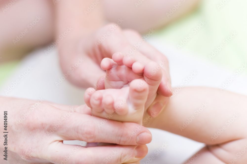 Mother gently hold baby leg in hand #4 Mother gently hold baby leg in hand #4