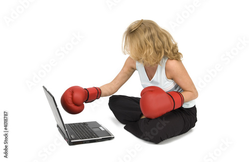 Woman boxes laptop.