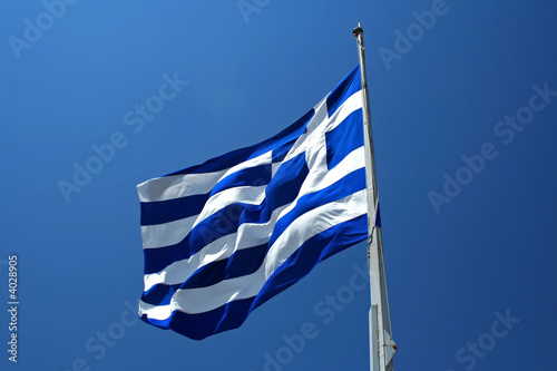 Greek national flag on blue sky