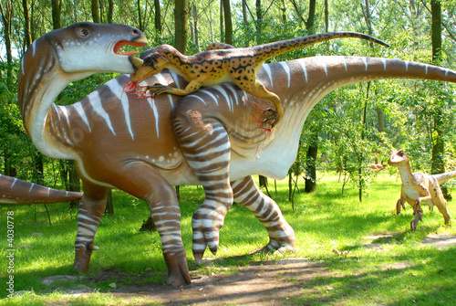 фотографія Dinosaur Deinonych attacking Iguanodon in jurassic park, dinosaur series