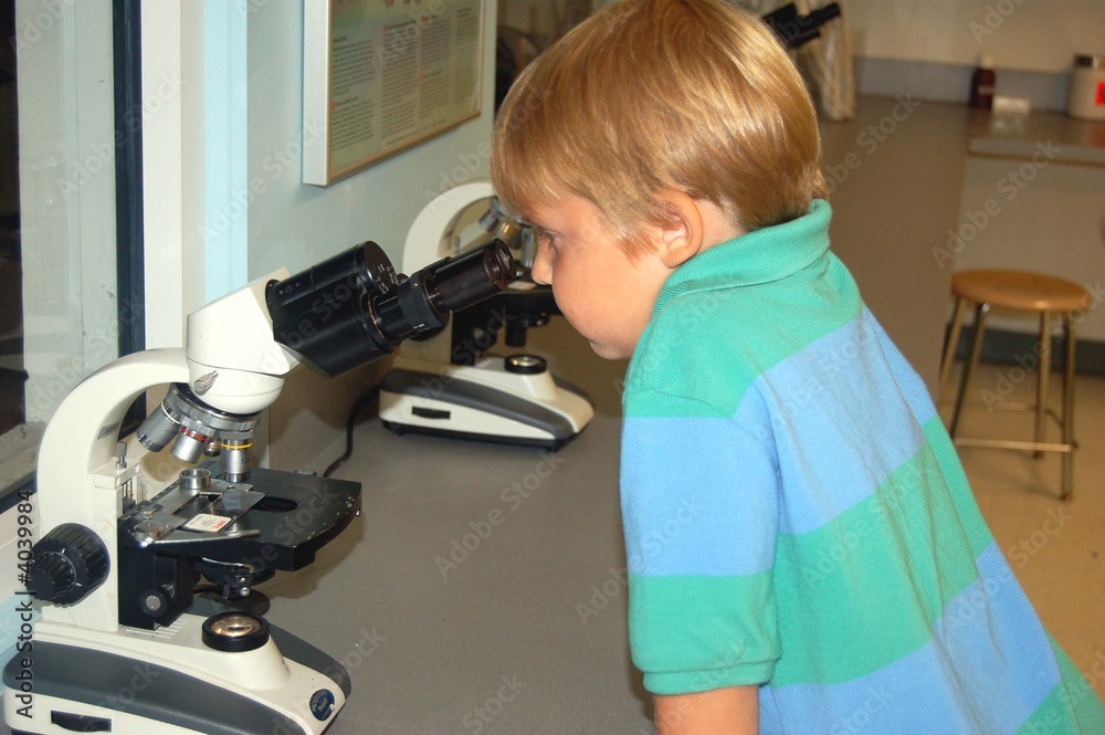 Boy Looking Through a Microscope Boy Looking Through a Microscope