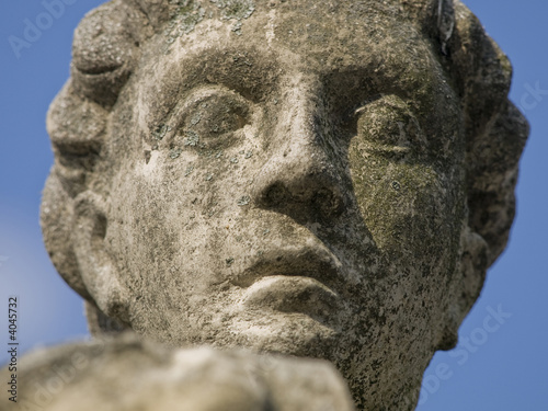 Old statue in the park head detail, Graz, Austria