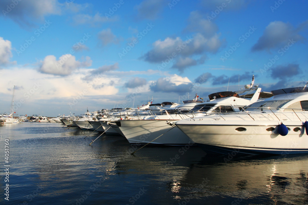 Fototapeta premium Beautiful sailboats lined up in a row
