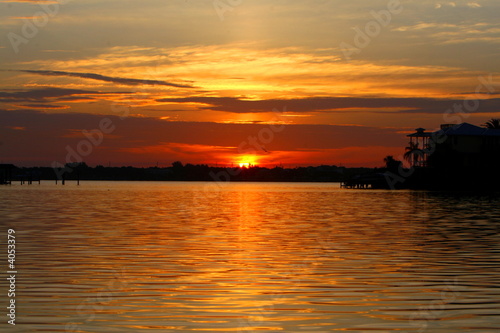 house on the water during sunset, florida 2