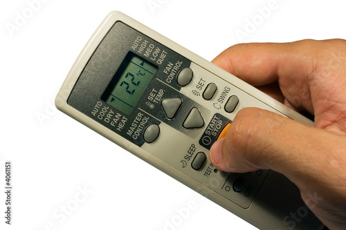 Conditioner remote control in the hand.