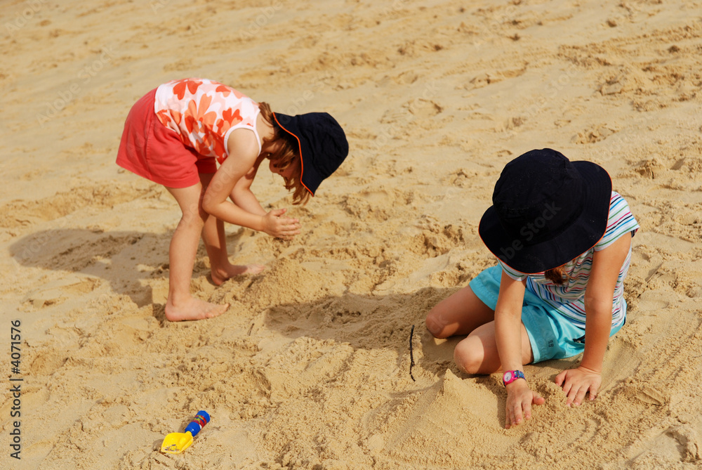 Children playing sands at the beach Children playing sands at the beach