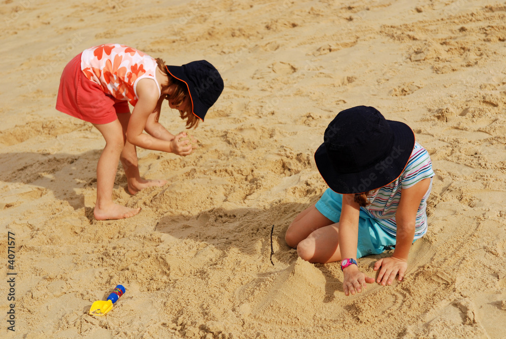 Children playing sands at the beach Children playing sands at the beach