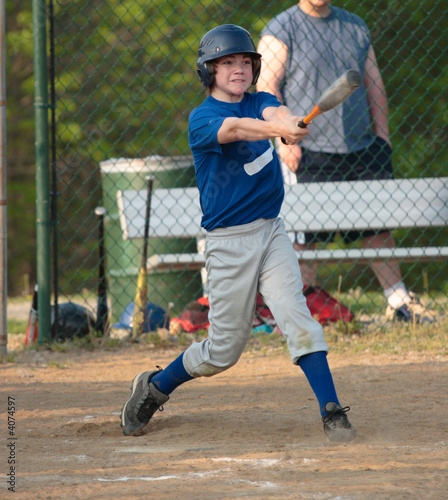 Baseball Player Swinging Bat