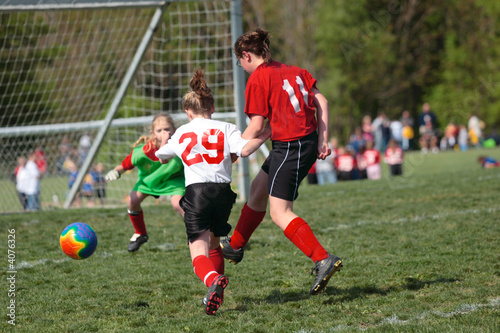 Youth Teen Girls in Action on Soccer Field