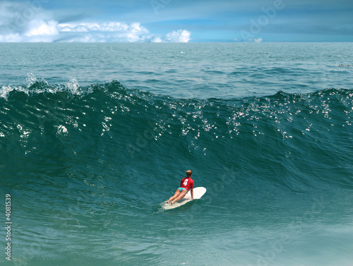 Photography Young girl surfing on Malibu Beach, California