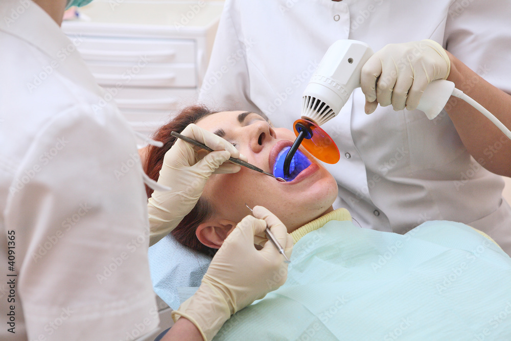Dentist at work in dental room Dentist at work in dental room