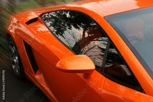 side of orange supercar