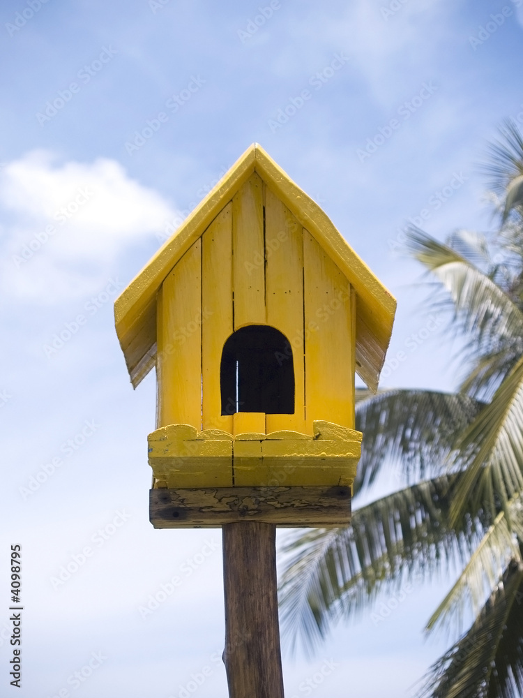 Yellow birdhouse