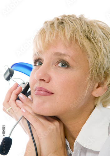 blond woman listening to music with headset