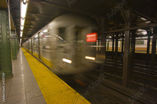 New York subway speeding by a platform