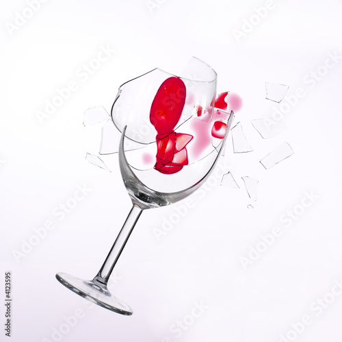fallen wine glass with red wine in it