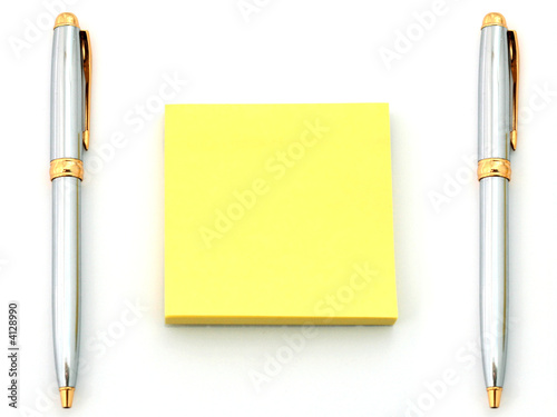 pens and yellow paper