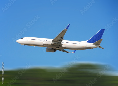 Modern jetliner taking off with motion blur
