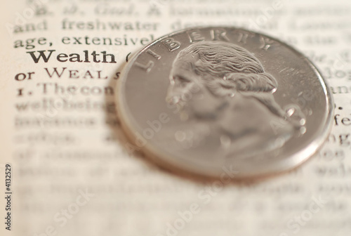 the word wealth with coin photo