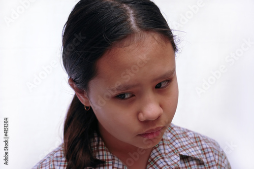 schoolgirl looking downwards