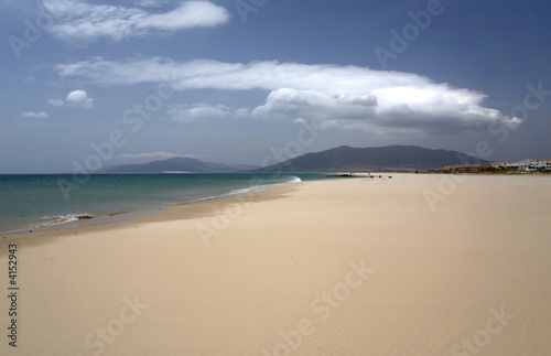 Sandy beach in Spain. Sky and clouds.