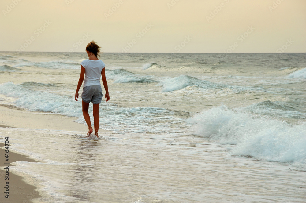 Young Girl Walking on Beach