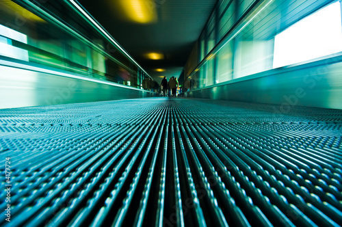 Fototapeta Naklejka Na Ścianę i Meble -  traveling on a moving escalator