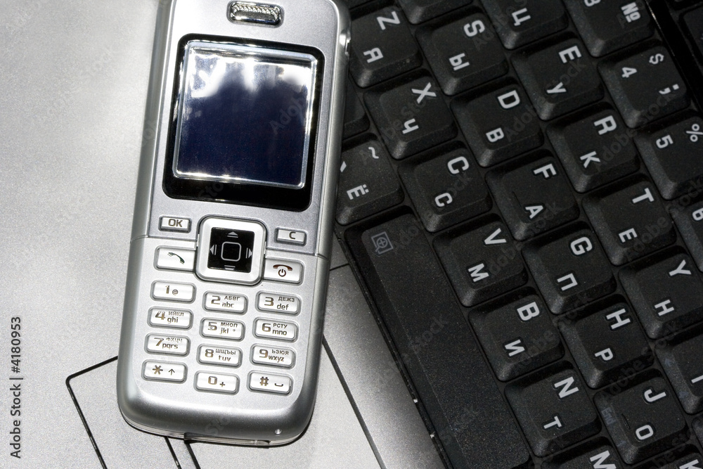 Mobile phone and computer keyboard (business conception)