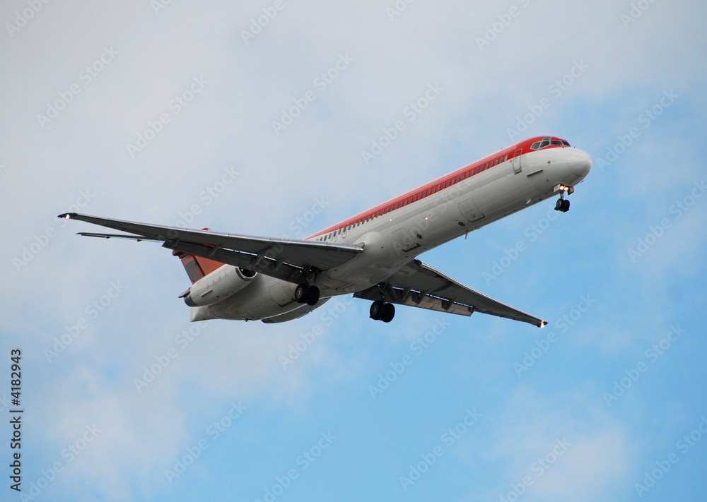 Airborne modern passenger airplane approaching destination