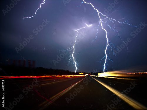 Twin lightning bolts strike highway