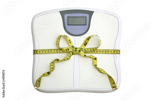 Concept: Scale with tape measure tied in a bow.