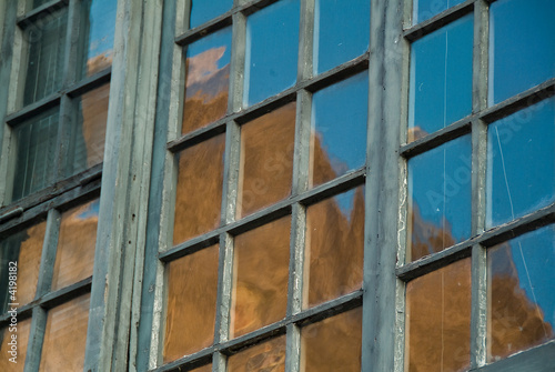 Colonial Window Panes with brick building reflected