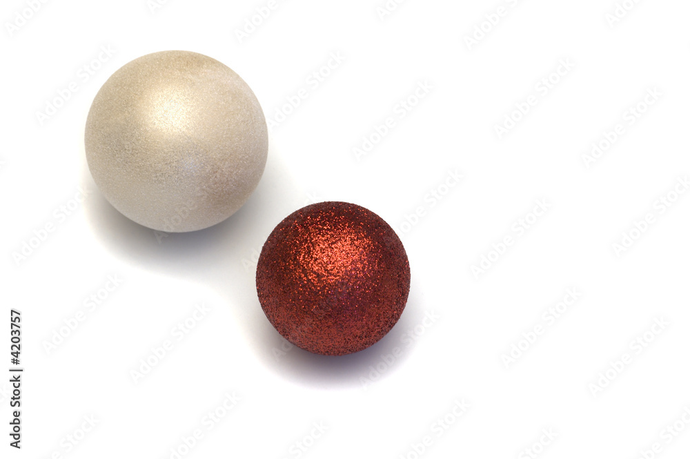 Two glittery decoration balls for Christmas on white background