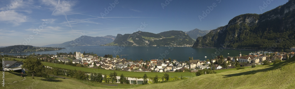 Large panorama of Swiss mountains and town by the lake of Luzern