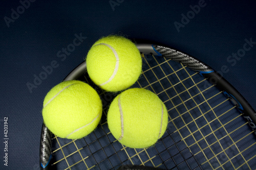 Tennis Balls and Racket © JJAVA