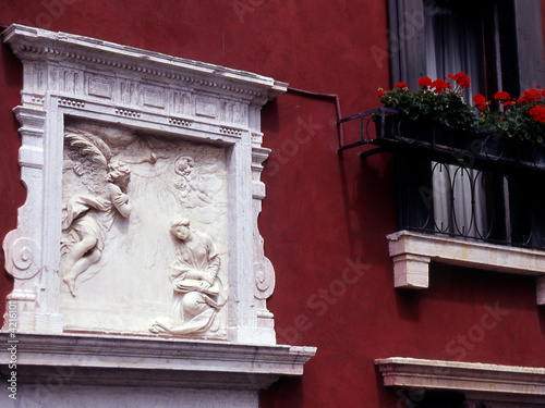 Canvas Print Carving and windowbox on house in Venice Italy
