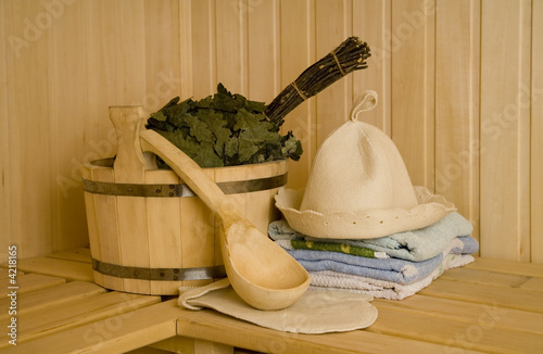 Wooden wash-tub with scoop in steam bath-room   photo