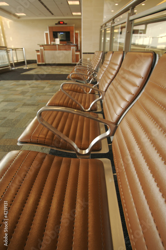 Abstract, Retro waiting room seating and gate desk at airport. © Andy Dean