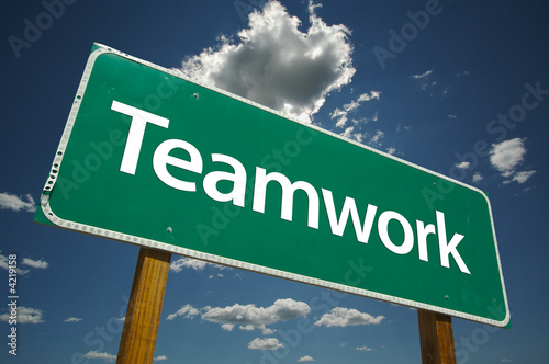 Teamwork Road Sign with dramatic blue sky and clouds