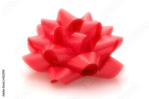 Red bow with a dreamy quality isolated on white