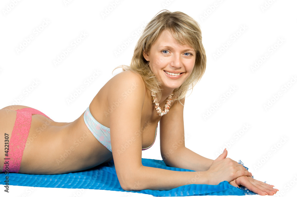 Beauty blonde relaxing on the towel beach