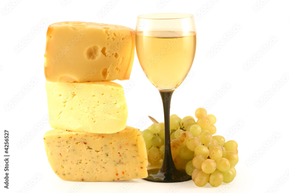 Grapes, cheese and a glass with wine isolated on white. Grapes, cheese and a glass with wine isolated on white.
