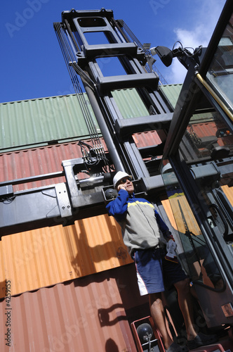 engineer, forklift and containers photo