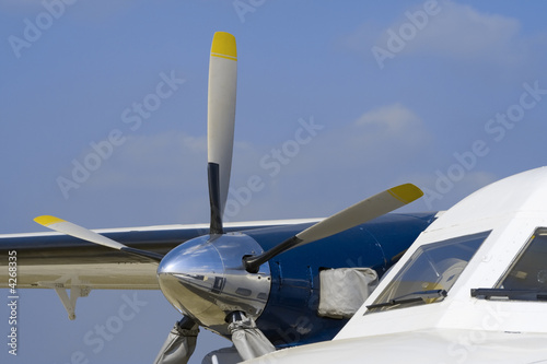 white aircraft with turbo-prop engine
