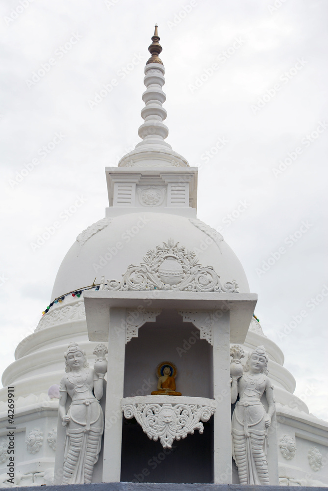 Buddha and white stupa