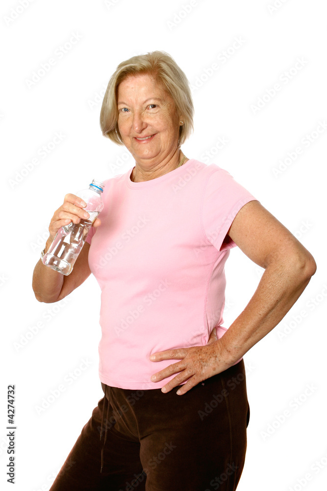 Mature caucasian female having a drink of water Mature caucasian female having a drink of water
