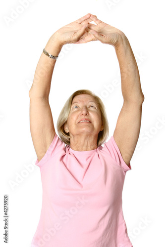 Mature caucasian female doing her exercises,