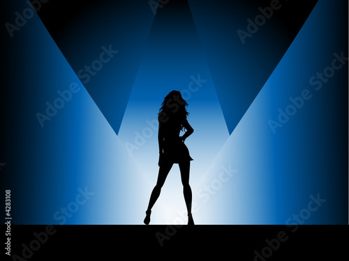 Sexy female in spotlight